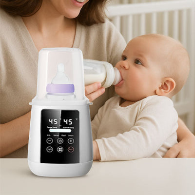 Maman donnant biberon bebe chauffe biberon Bibeheat sur la table