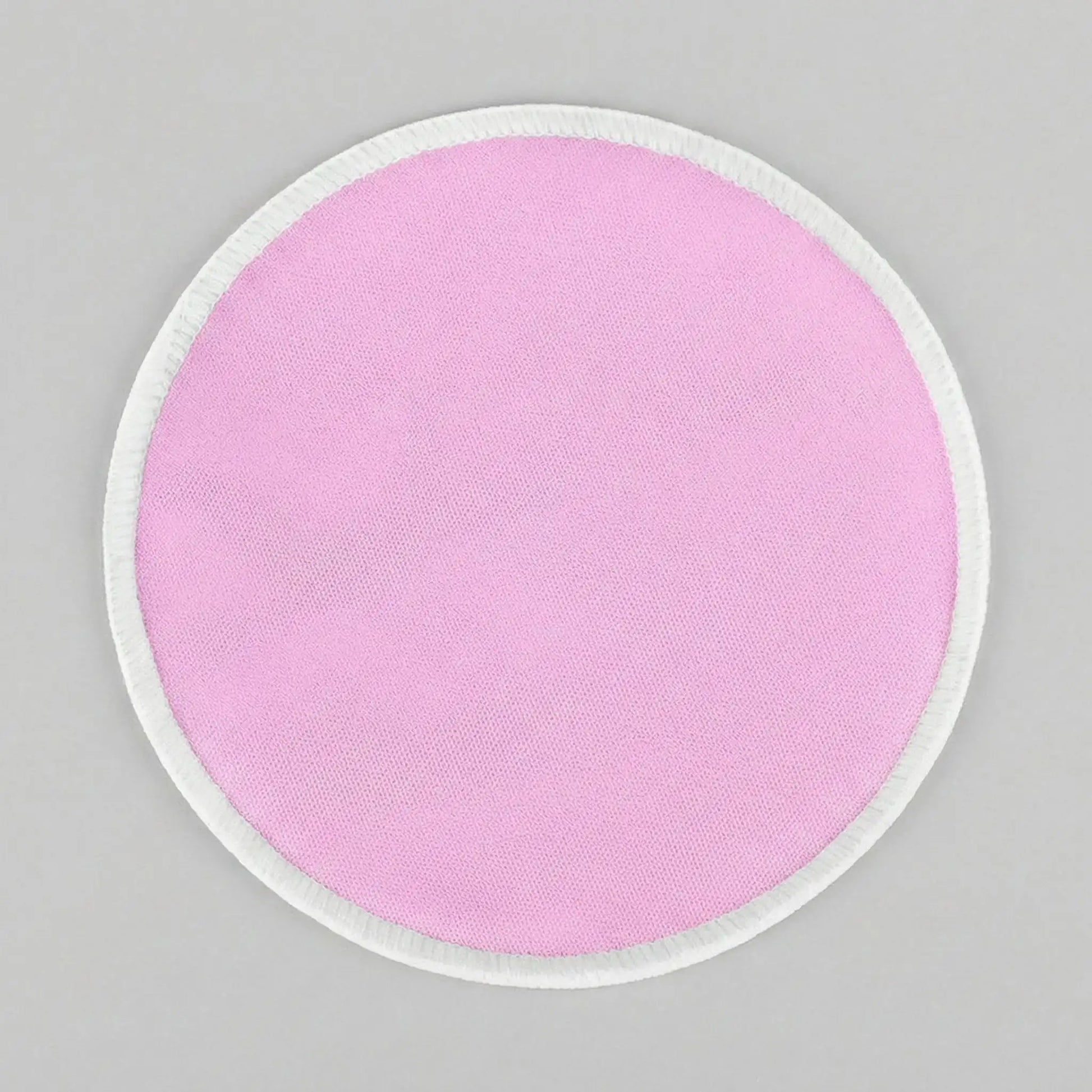 Un des coussinets d'allaitement rose Tenous