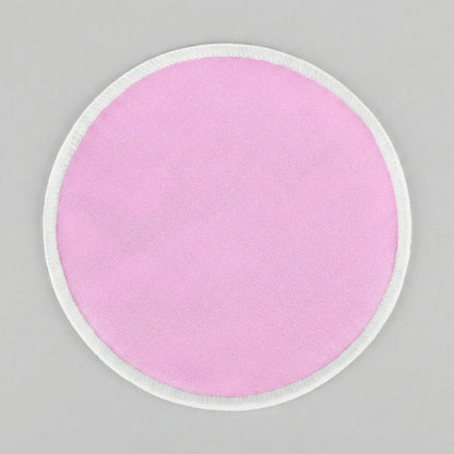 Un des coussinets d'allaitement rose Tenous